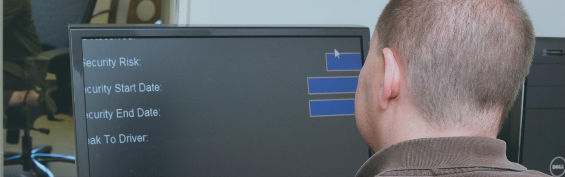 Man viewing computer using Zoom Text assistive technology