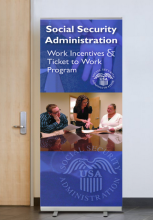 Display banner featuring an employee signing to other employees using American Sign Language (ASL).
