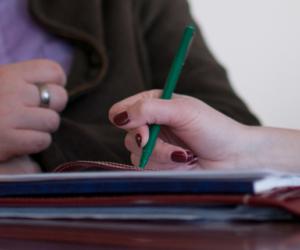 Two individuals working on a report.