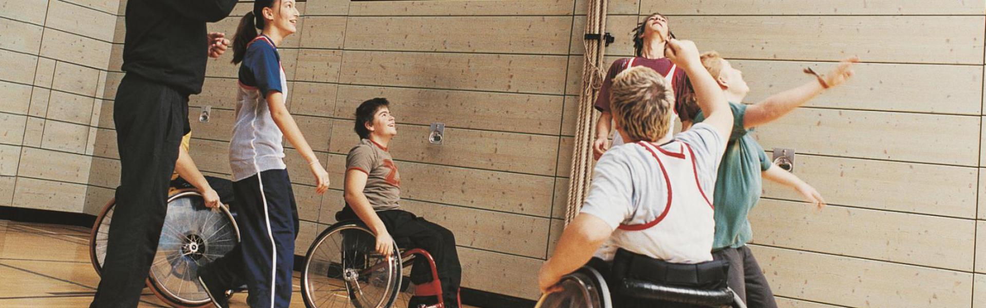 Students with disabilities playing basketball.